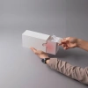 The white paper box packaging box can be opened by hand to reveal the filling inside Application Scenario
